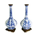 A pair of Chinese gilt-metal mounted blue and white bottle vases, Kangxi (1662-1722),