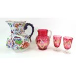 A Masons Ironstone toilet jug, 28cm high, together with a cranberry glass jug,