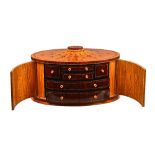 Max Cooper; an oval table top collector's box,