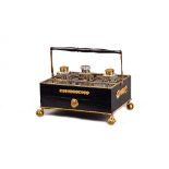 A French Empire style gilt metal mounted ebonised desk stand,