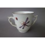 A Chelsea two-handled cup, red anchor period, circa 1755, painted with a bird in branches,