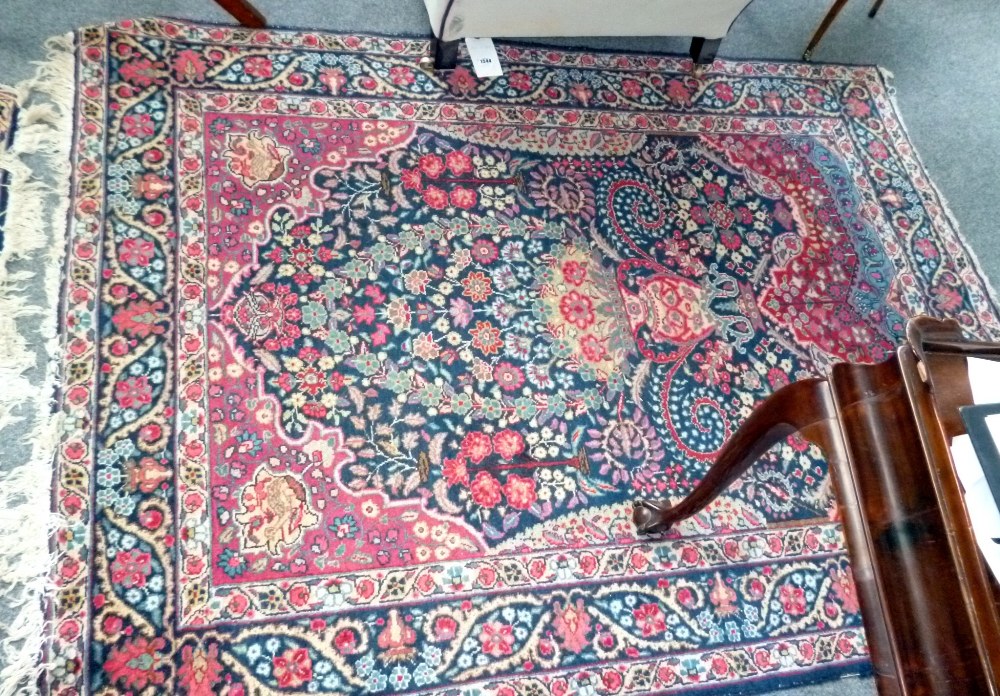 A pair of Tabriz prayer rugs, Persian, the dark indigo floral mihrab with a large vase, - Image 4 of 4
