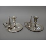 A pair of George III silver chamber candlesticks,