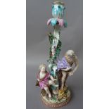 A Meissen porcelain figural candlestick, 19th century, emblematic of Winter,