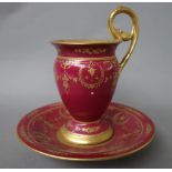 A Berlin porcelain claret-ground cabinet cup and saucer, circa 1915-18,