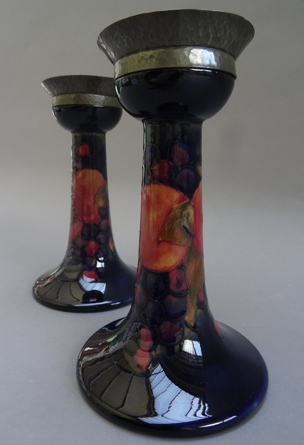 A pair of Moorcroft pottery candlesticks, decorated in the 'Pomegranate' pattern, circa 1920, - Image 2 of 9