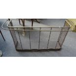 A Victorian brass and wire mesh fire fender with hanging rail (134cm wide) and one other Victorian