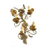 A pair of modern wrought iron and giltwood carved four branch wall appliques,