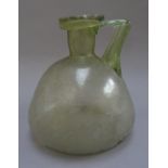 A Roman pale green glass flask, circa 3rd-4th century A.