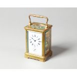 A French brass carriage clock Circa 1910 In a corniche case with push/repeat,
