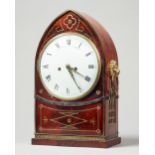 A Regency mahogany and brass line inlaid lancet-shaped mantel clock Retailed by John Grant,
