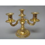 A French silver gilt three light table candelabrum,