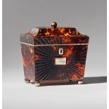 A Regency tortoiseshell and ivory tea caddy of sarcophagus form, with single lidded interior, 11.