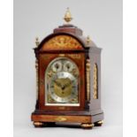 A Victorian rosewood and cut-brass inlaid three-train chiming mantel clock By Benson, London,