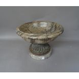 A near pair of serpentine marble footed urns, 20th century, of turned circular form,