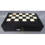 An Anglo-Indian stained ivory folding chess and backgammon board, late 19th century,