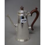 A silver coffee pot, of tapering cylindrical form, with composition fittings,