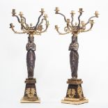 A pair of Empire style gilt and patinated bronze eight branch figural candelabra, 20th century,