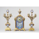 A French Orientalist ormolu and champleve clock garniture circa 1880 Comprising a clock and a pair