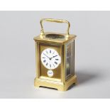 A French gilt brass carriage clock Circa 1910 In a corniche case with push/repeat,