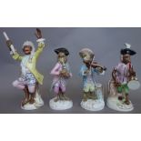 Nineteen porcelain monkey band figures, 20th century, part sets and singles (a.