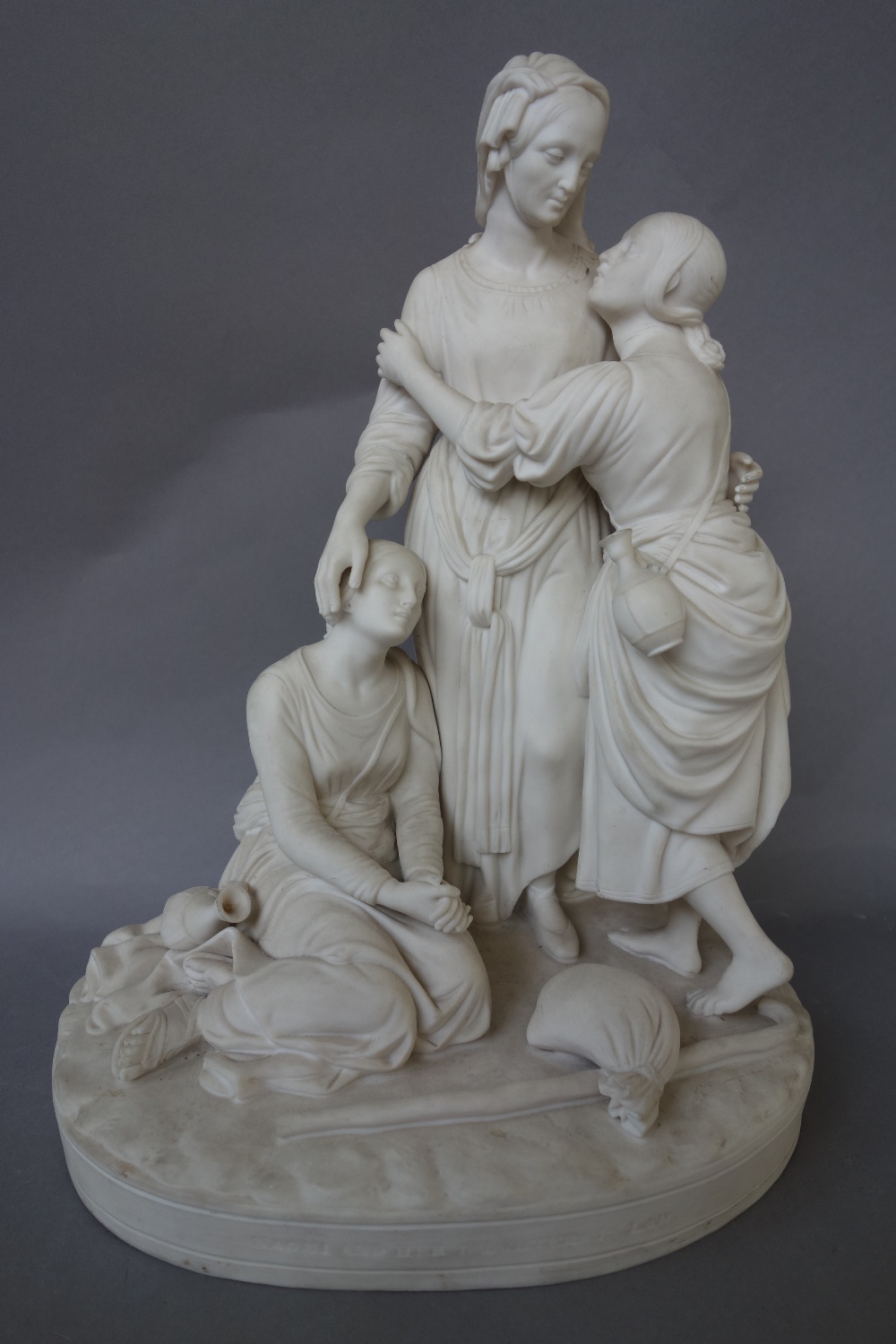 A Minton parian group, `Naomi and her daughters in law', circa 1858, raised on an oval titled base,