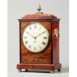 A late Regency mahogany and cut-brass inlaid bracket timepiece The case with a gadrooned pediment,