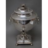 A Victorian plated on copper twin handled tea urn, with a detachable cover,