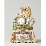 A French porcelain mantel clock In the style of Jacob Petit,