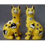 A pair of Griselda Hill pottery `Wemyss ware' cats, late 20th century,