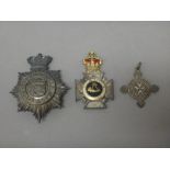 A Victorian silver plated hat badge, detailed South West Middlesex Rifles, an enamelled medal,