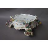 A Meissen porcelain stand, late 19th century, of shaped square form,