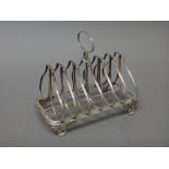 A Victorian silver seven bar toast rack,of shaped form with an oval loop shaped handle,