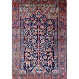 A Mahal Tree of Life prayer rug, Persian, the dark indigo mihrab filled with a floral tree,