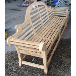 A 20th century Lutyens style hardwood garden bench, with slatted seat and block supports,