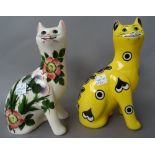 A pair of Griselda Hill pottery `Wemyss ware' cats decorated with thistles (17.