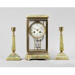 A French giltbrass, enamel and green onyx four glass mantel clock garniture circa 1910 The clock,