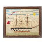 A polychrome ship woolwork picture, detailed as a fully rigged British war ship at full sail,