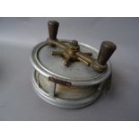 A Hardy 'Fotuna' 7 inch sea fishing reel, twin reverse taper handles on a brass bar,