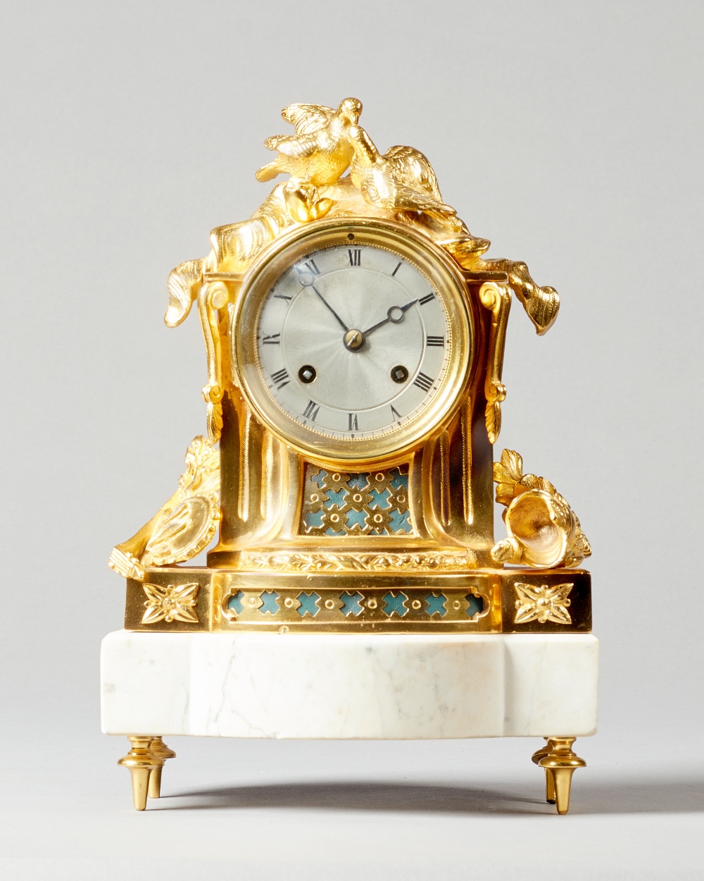 A Napoleon III ormolu and white marble mantel clock In the Louis XVI style,