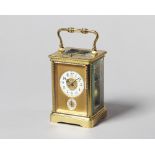 A French brass carriage clock Circa 1910 In a corniche type case with decoration,