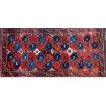An Uzbek Karakalpak carpet, the madder field with six pairs of bold guls,