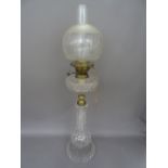 An Edwardian cut glass oil lamp, with matching reservoir,