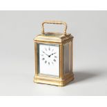 A French brass carriage timepiece Circa 1890 In a gorge case, with white enamel dial,