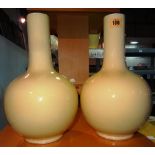A pair of Chinese yellow glazed baluster shaped vases,