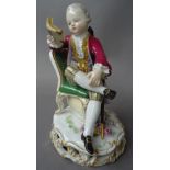 A Meissen porcelain figure of a boy reading a book, circa 1900, incised C28, stamped 127,