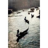 A reproduction print of a photograph of gondolas in Venice and another of children jumping off