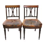 A pair of Regency mahogany dining chairs, with panelled curved top rails,
