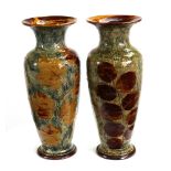 A pair of Doulton Lambeth Autumn Leaves pattern inverted baluster vases, 41cm high.