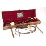 An early 20th century leather shotgun case, with brass corners and lock,